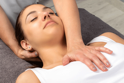 Osteopathic doctor using manual therapy